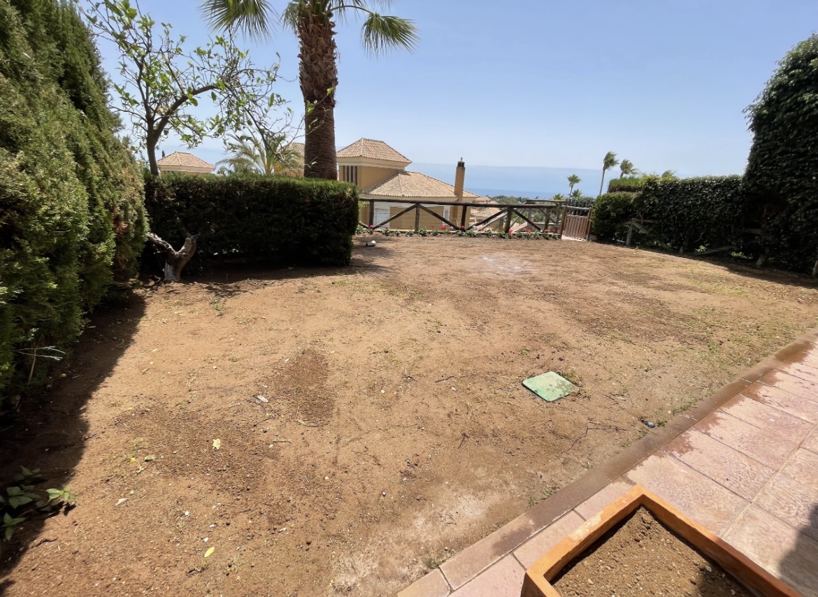 Before photo of an un-seeded garden on the Costa del Sol